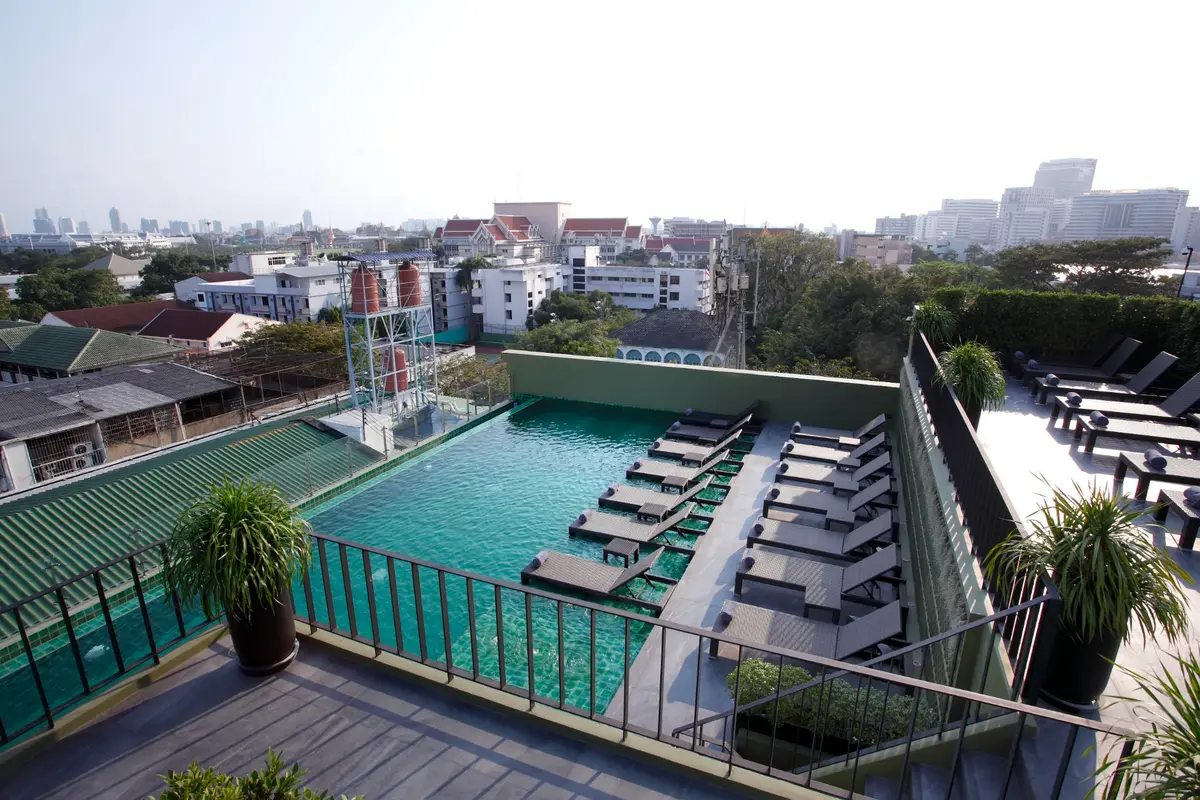 Rooftop swimming pool and sun loungers