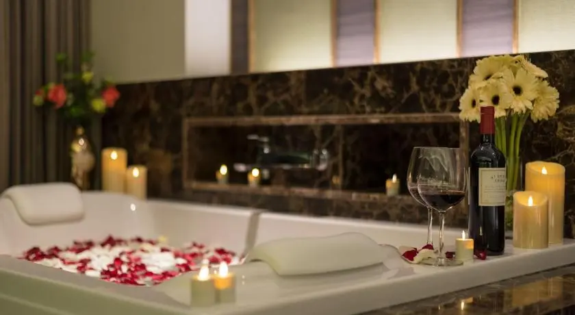 Premier private whirlpool bathtub with flowers and wine